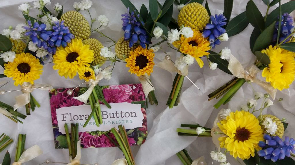 Vibrant buttonholes blue and yellow